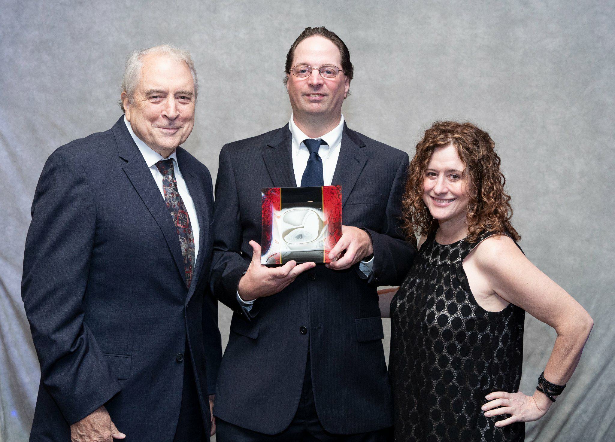 Kevin-with-his-sister-and-brother-award-for-self-advocacy.jpg